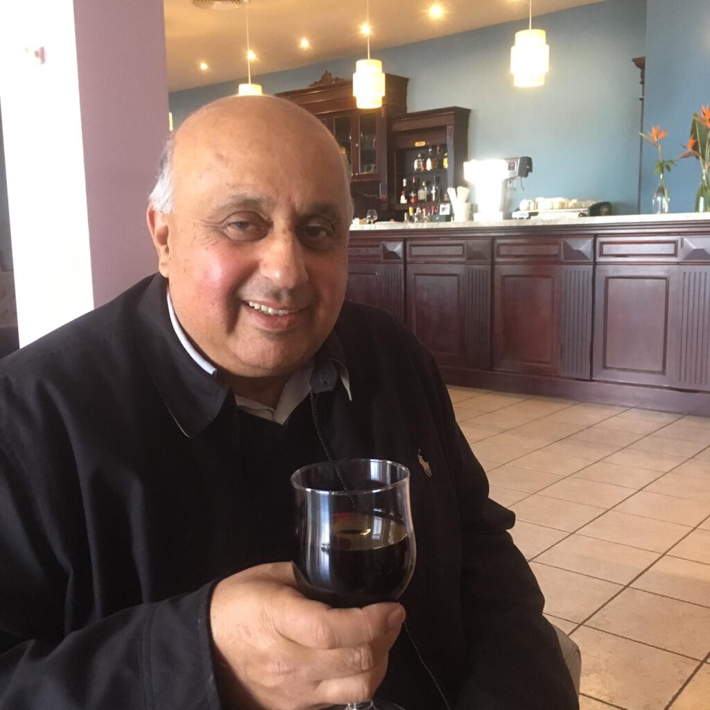 Naresh Sethi with glass of wine