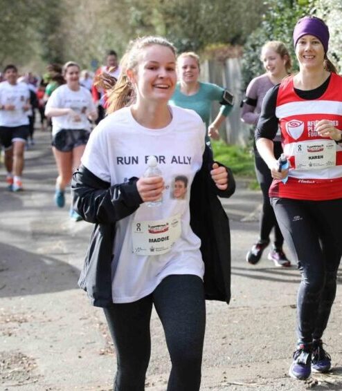 Madeline Kuncewicz (Ha 13) running the Hampton Court Half Marathon